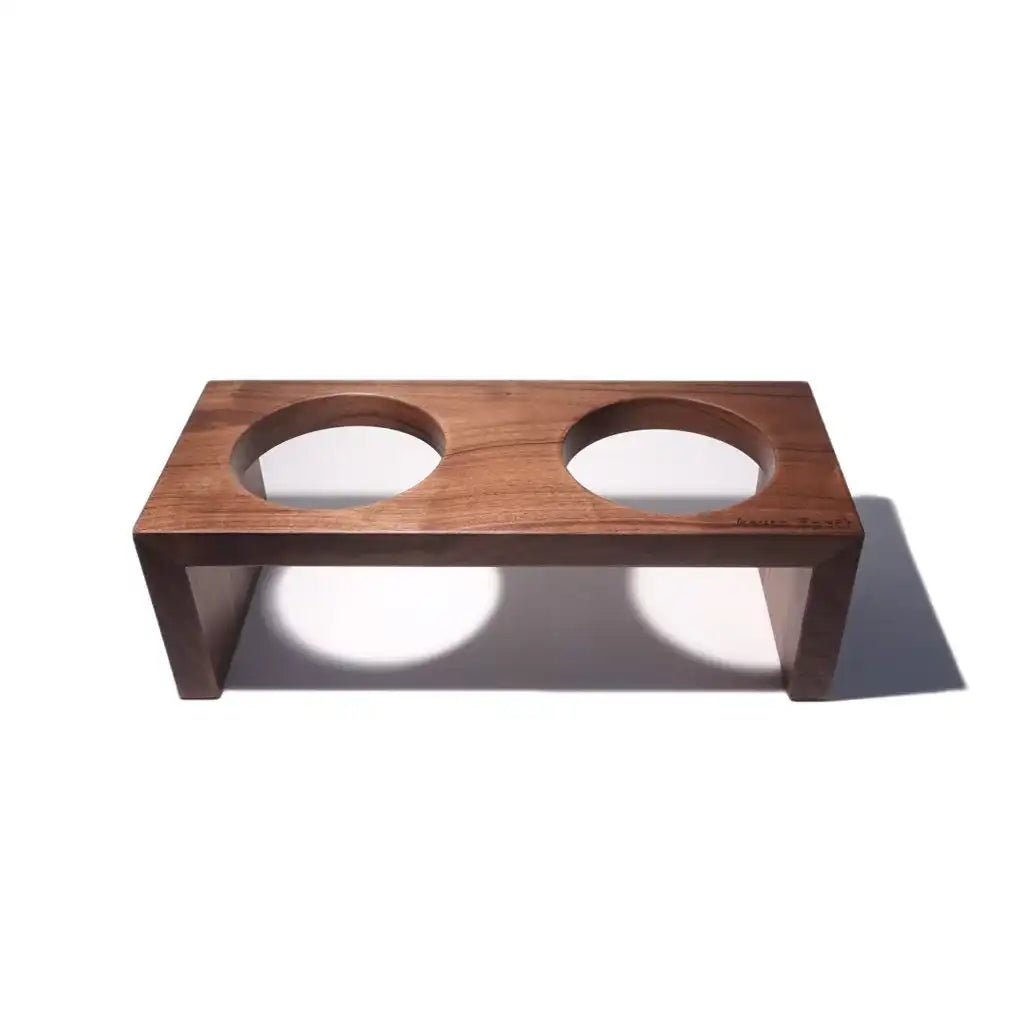 dbl Wooden pet feeder with two circular cutouts on a white background