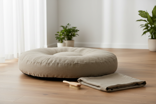Clean dog bed with removable linen cover on a light hardwood floor — a guide to washing dog beds properly, by LAVORA