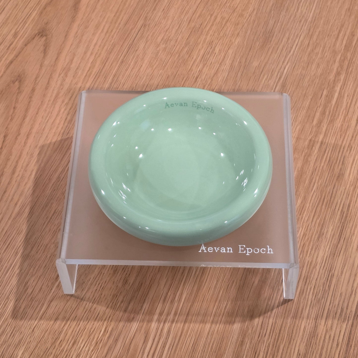 Frosted acrylic pet feeding stand with a quiet visual presence in the home