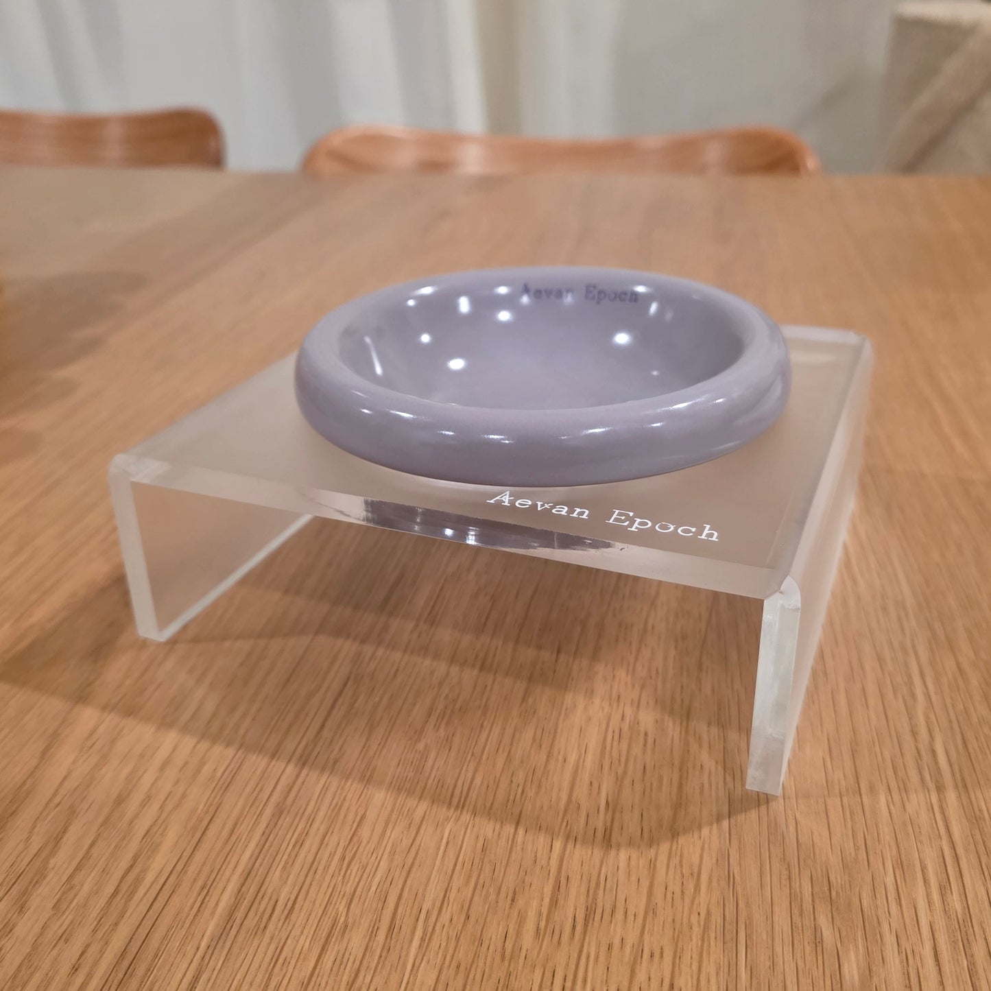Elevated acrylic pet feeder designed for a clean, low-profile feeding corner