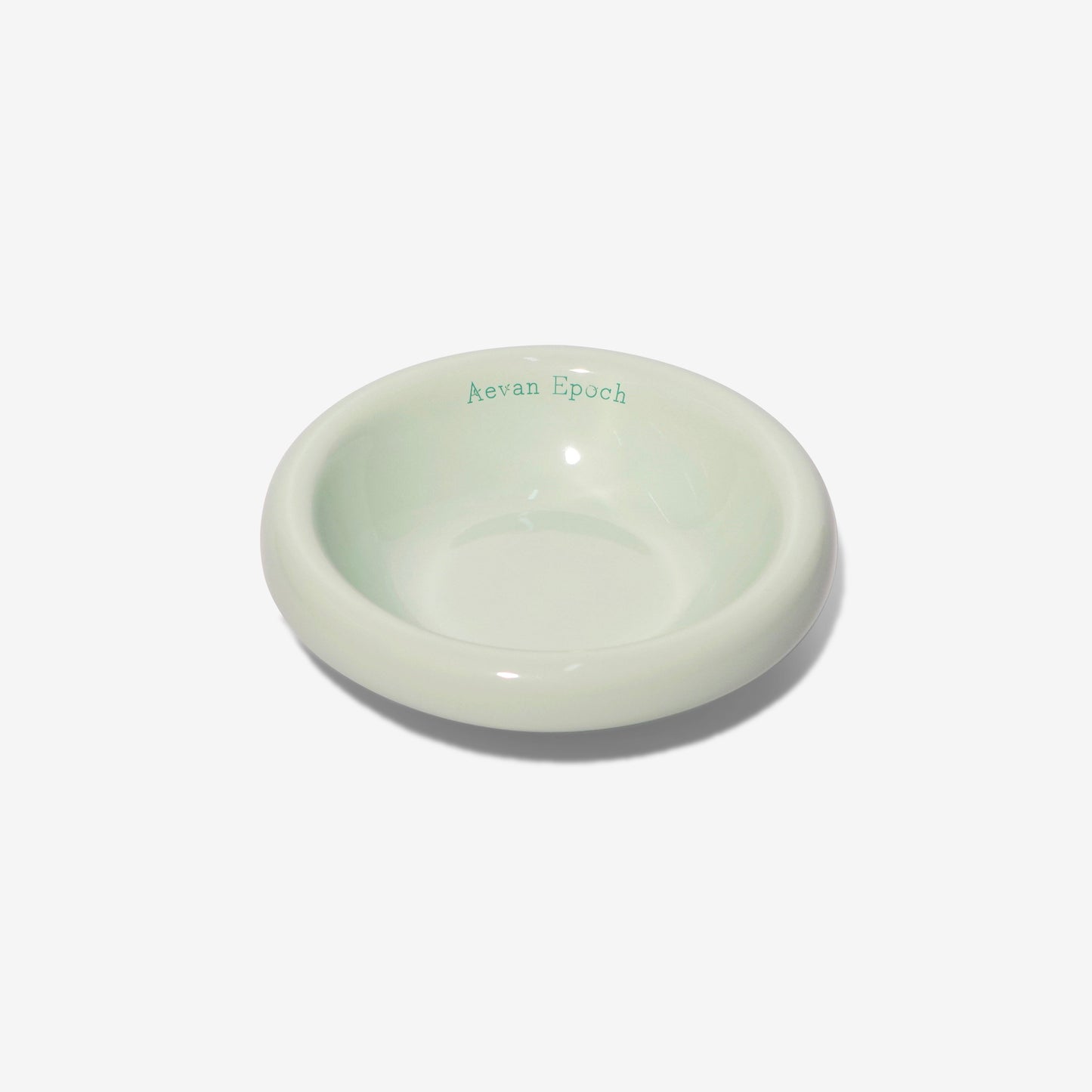 Round ceramic dish with 'Nevan Epoch' branding on a white background