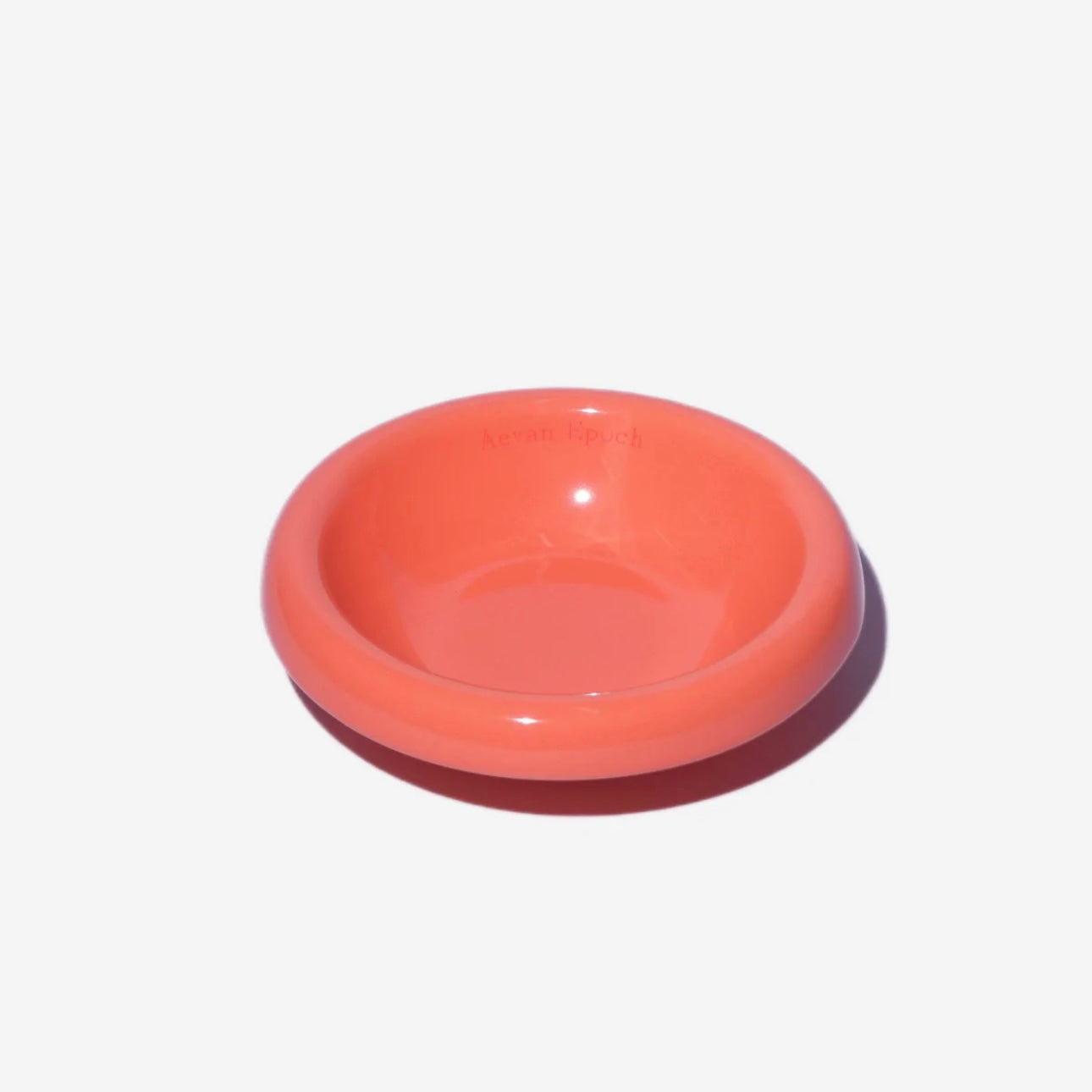 Coral-colored glossy Aevan Epoch stoneware pet bowl for food or water use