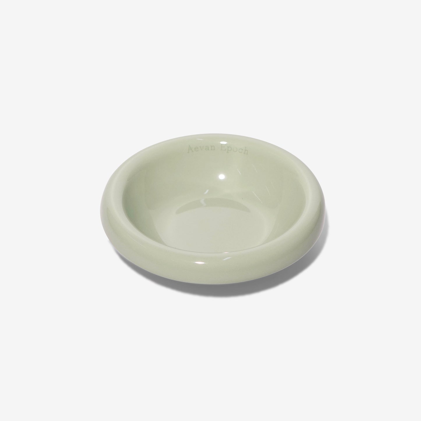 Light green ceramic bowl on a white background