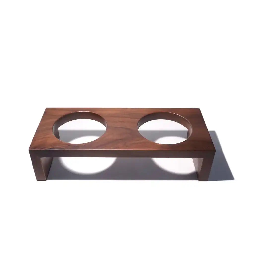Wooden pet feeder with two circular cutouts 