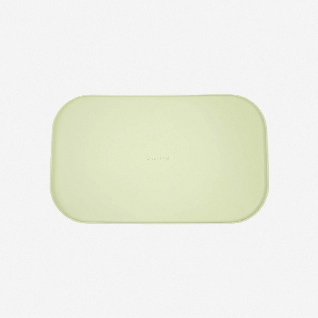 Avocado green silicone pet feeding mat with low-profile raised edges