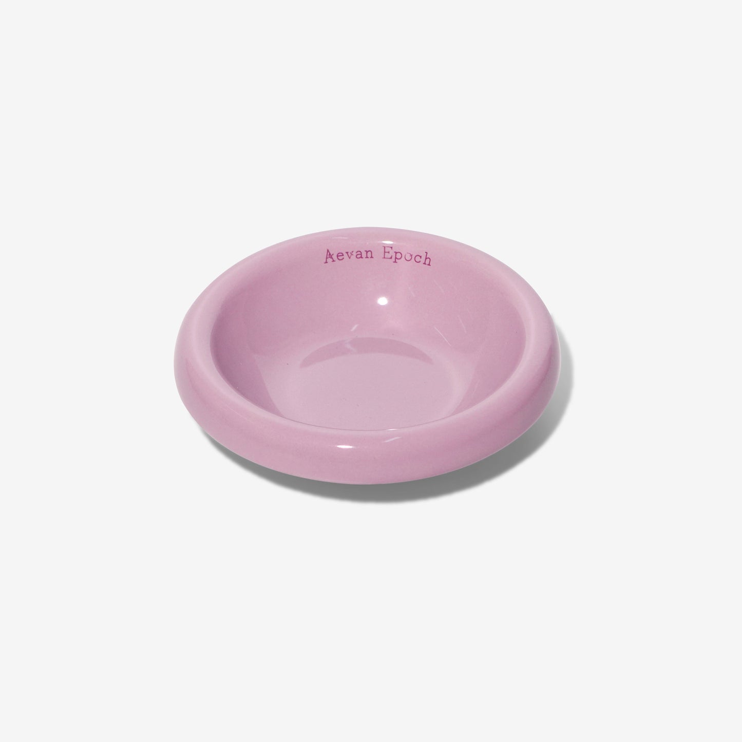 Pink ceramic bowl on a white background