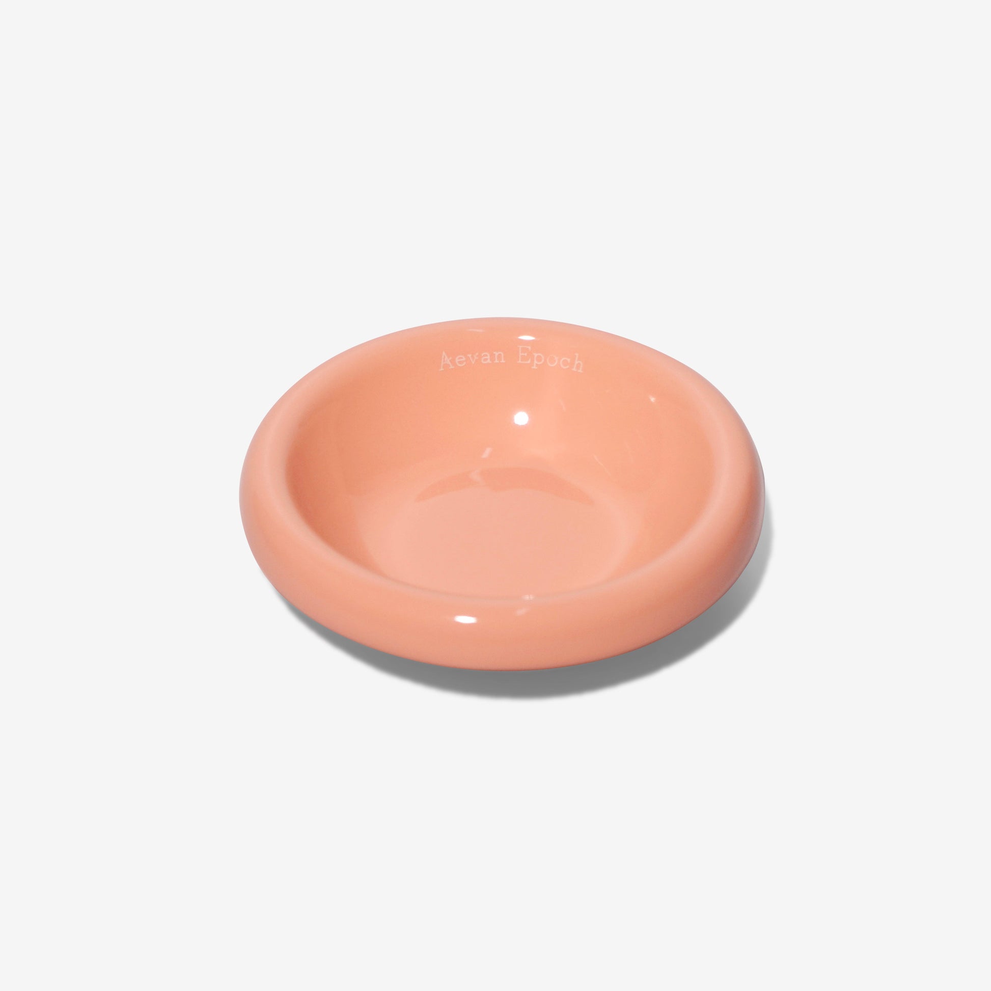 Pink ceramic bowl on a light gray background