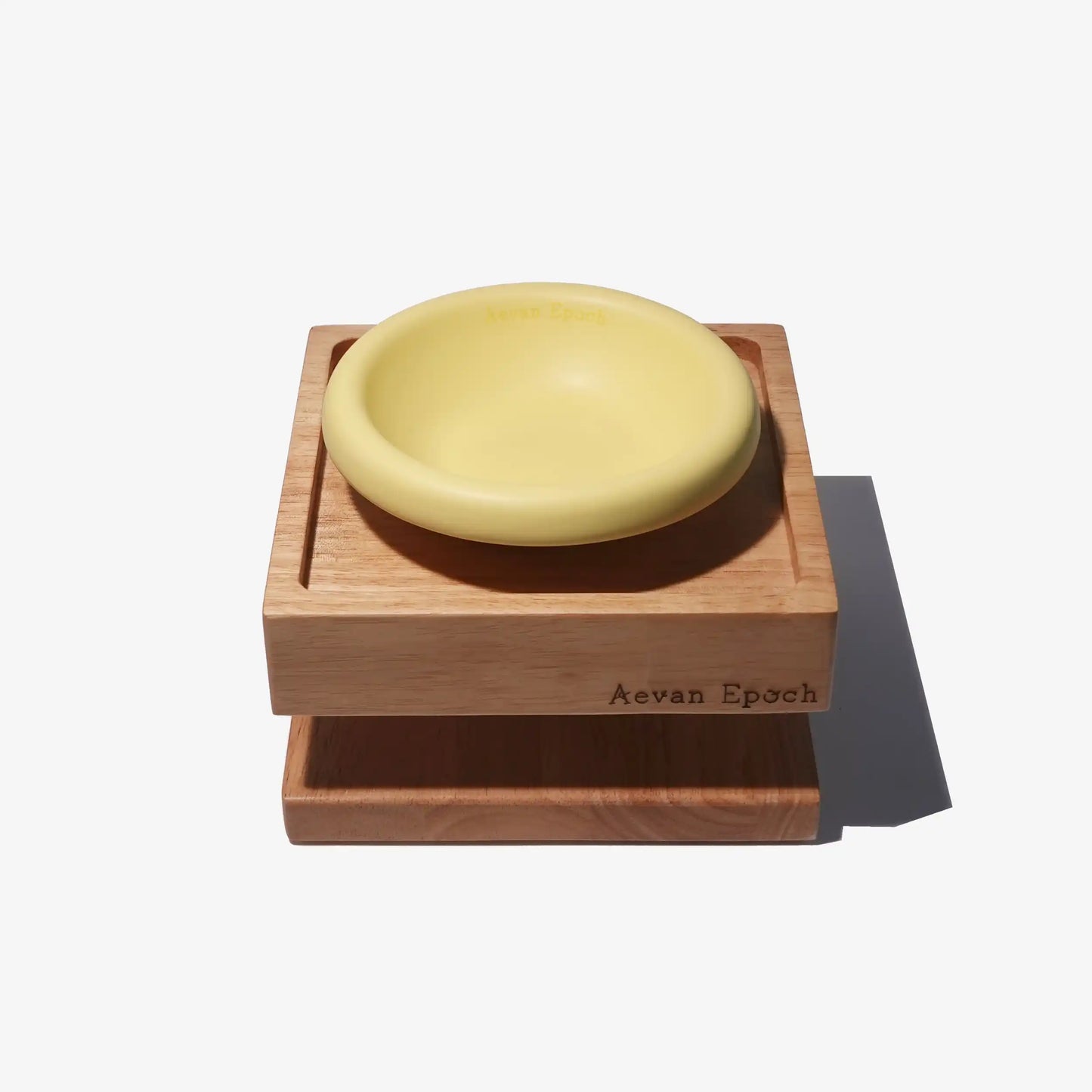 wooden stand with 'Aeven Epoch' branding on a white background